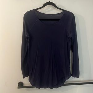 Lululemon navy blue long sleeve shirt. Longer in the back. Scoop neck.
